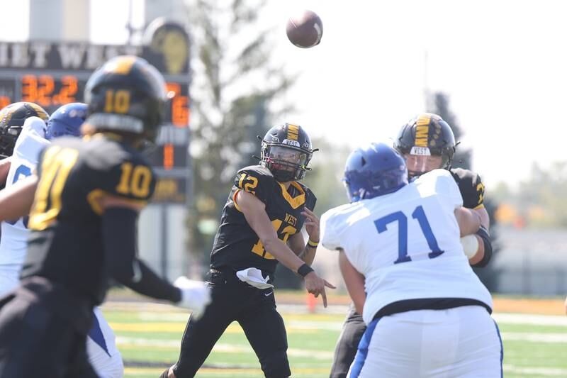 Joliet West’s Alexander Cruz (12) finds an open Parker Schwarting (10) for a touchdown against Joliet Central on Saturday, Sept. 23, 2023 in Joliet.