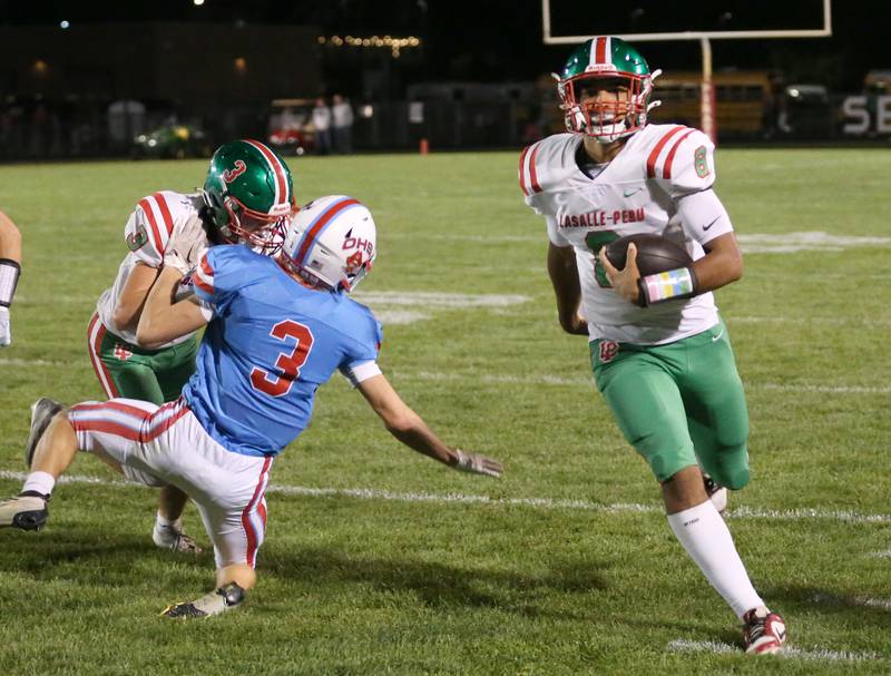 L-P quarterback Marion Persich carries the ball as teammate Michael Hartman blocks Ottawa's George Shumway on Friday, Oct. 4, 2024, at King Field.