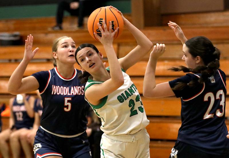 Alden-Hebron's Nathalia Mendoza works her way out of a double team by Woodlands Academy's Lucy Petherbridge (left) and Eloise Hartman (right) during a nononference girls basketball game on Thursday, Jan. 29, 2026, at Alden-Hebron High School in Hebron.