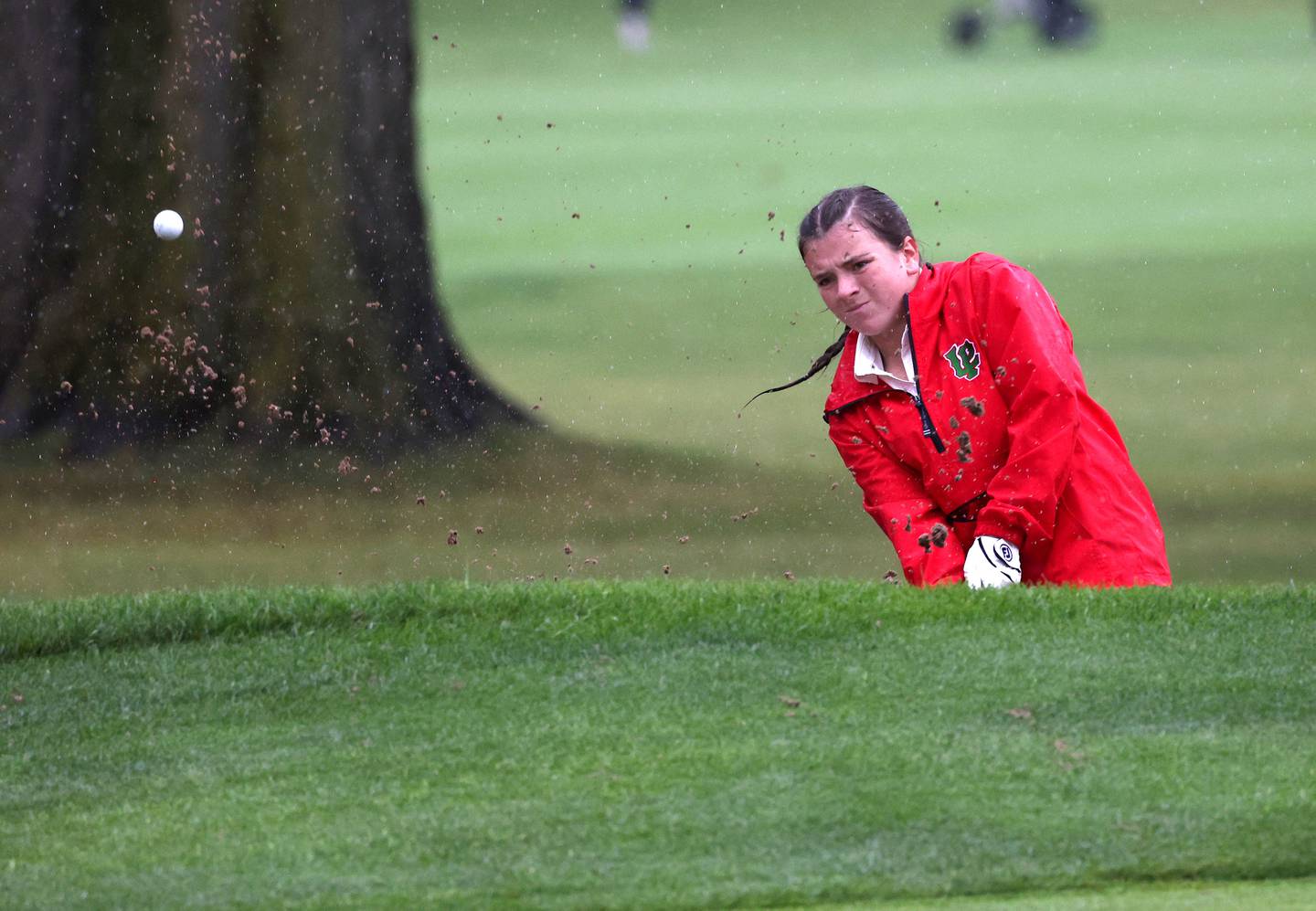 LaSalle-Peru’s Allie Thome blasts her ball out of the sand trap on the second hole Tuesday, Sept. 24, 2024, during the Interstate 8 girls golf tournament at the Sycamore Golf Club.