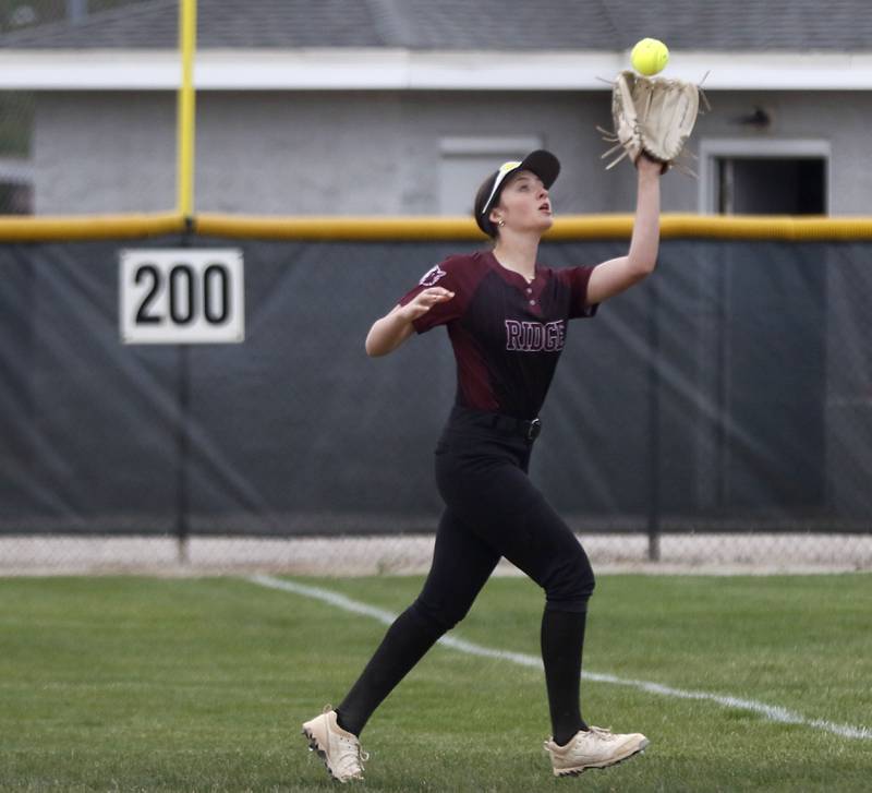 Prairie Ridge's Parker Frey catche s a fly ball during the Class 3A Prairie Ridge Regional Championship softball game against Cary-Grove on Friday, May 22, 2026, at Prairie Ridge High School.