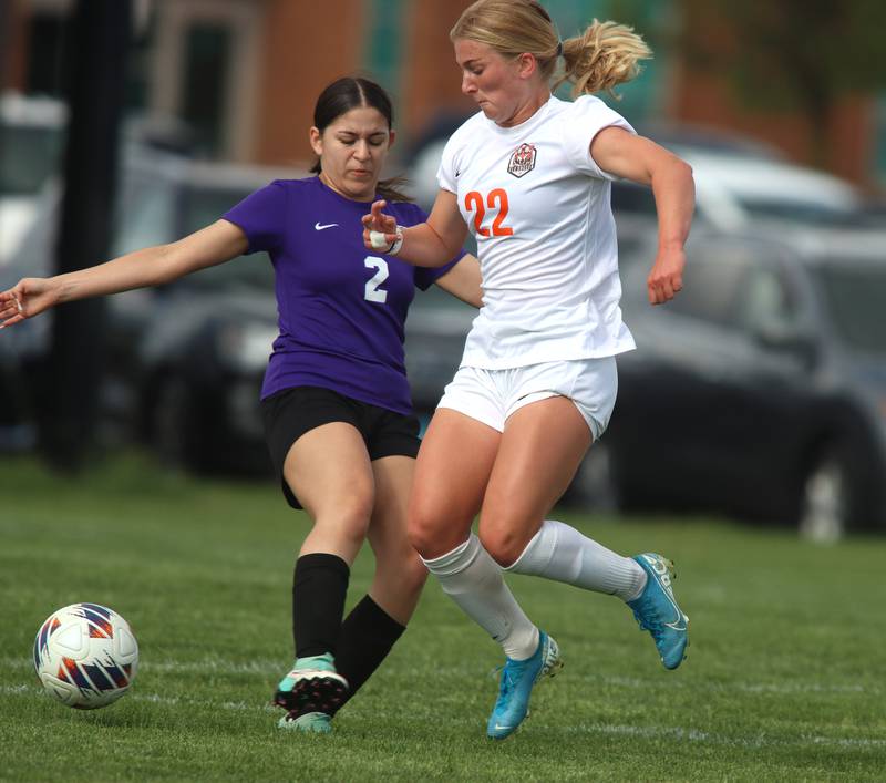 Hampshire’s Javelin Perez Garay, left, battles Crystal Lake Central’s Olivia Anderson in varsity soccer at Hampshire Tuesday evening.