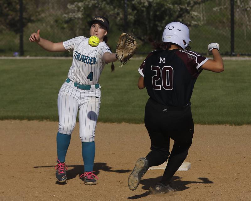 Woodstock North's Kylee Jordan tries to catch the throw as Marengo's Ariana Rodriguez runs into second base during a Kishwaukee River Conference softball game on Tuesday, April 28 , 2026, at Woodstock North High School.