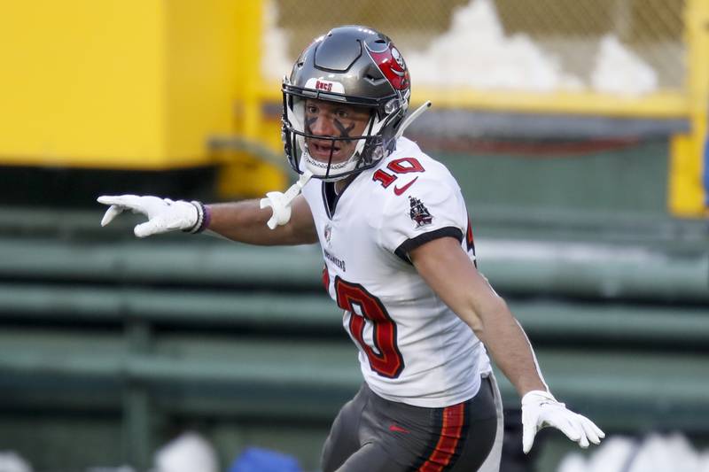 Tampa Bay Buccaneers' Scott Miller celebrates after catching a 39-yard touchdown pass against the Green Bay Packers during the first half of the NFC championship NFL football game in Green Bay, Wis., Sunday, Jan. 24, 2021. (AP Photo/Matt Ludtke)