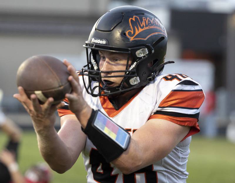 Milledgeville’s Spencer Nye hauls in a catch against Amboy Friday, August 29, 2025, in Amboy.