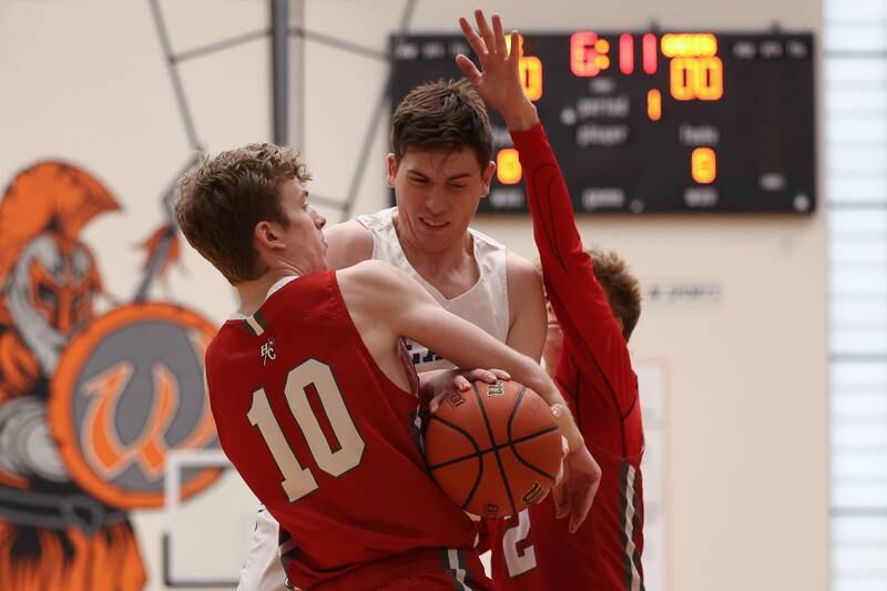 Hinsdale Central’s Billy Cernugel and Lincoln-Way East’s Mac Hagemaster force a jump ball trying to control the ball in the Lincoln-Way West Warrior Showdown on Saturday January 28th, 2023.