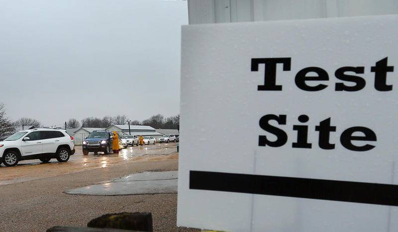A line of cars drive-thru the Bureau County Fairgroiunds in Princeton for free COVID-19 testing.