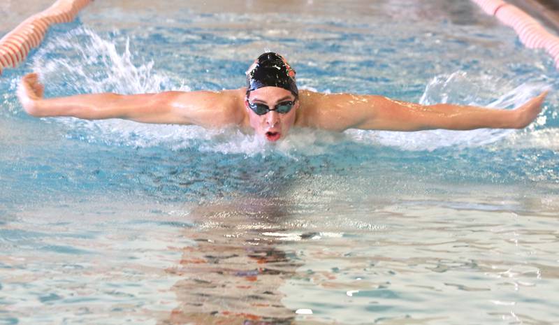 Tim Braun, a senior, swims the butterfly during DeKalb-Sycamore co-op boys swimming practice Monday at Huntley Middle School in DeKalb.