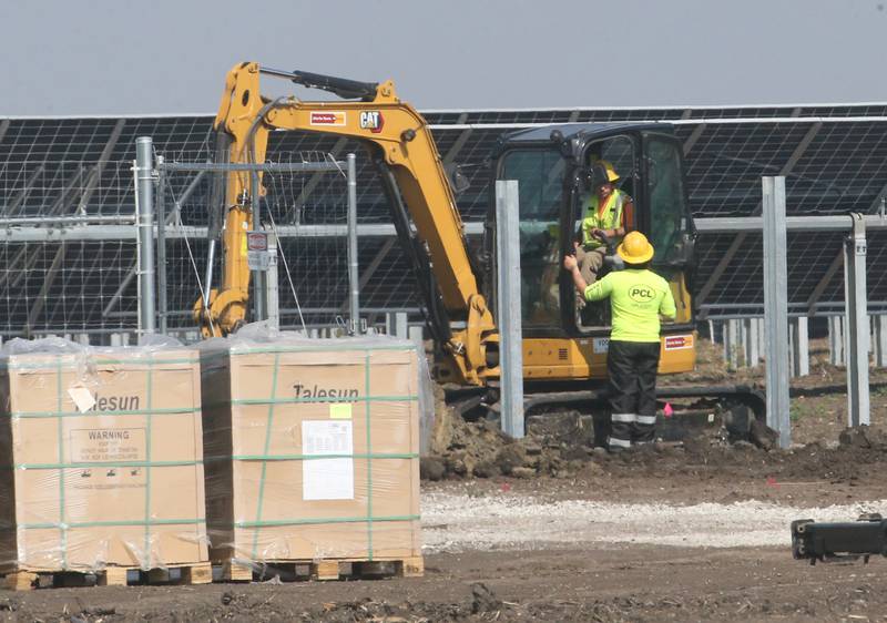 Crews work on a solar farm construction just north of the intersection of North 33 Road and Illinois Route 23 on Wednesday, May 14, 2025 north of Ottawa.