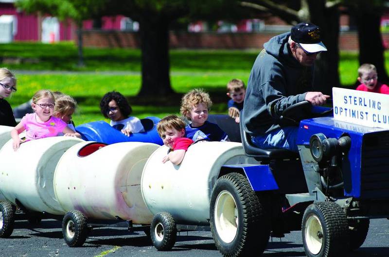 The Sterling Optimist Club rolled out the barrels Saturday, April 22, 2016, and they were soon full of smiling kids at Sauk Valley College during the Child Fair.