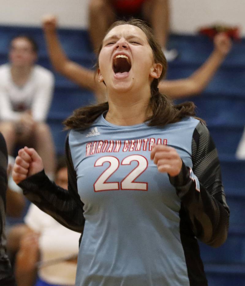 Marian Central's Anna Lingle reacts to wining the second game during a nonconference volleyball match against McHenry Monday, Aug. 28, 2023, at Marian Central Catholic High School.
