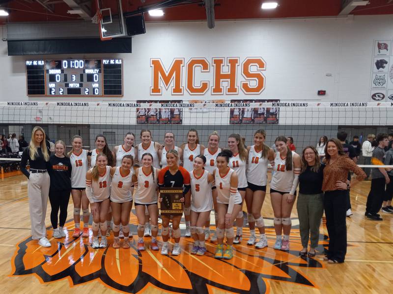 The Minooka volleyball team celebrates their win over Bradley-Bourbonnais in the IHSA Class 4A Minooka Regional championship on Oct. 30, 2025.