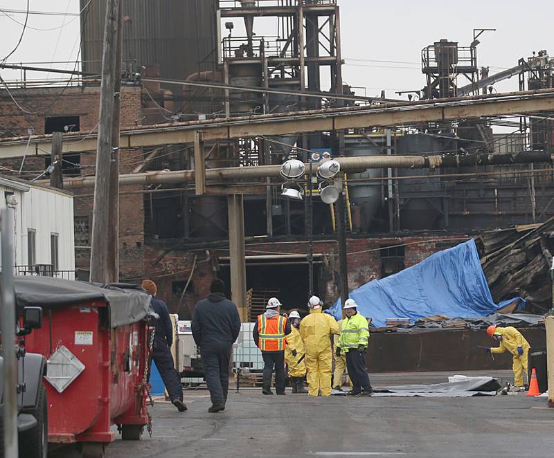 A hazmat team cleans up chemicals at Carus Chemical on Tuesday, Jan. 17, 2023 in La Salle.