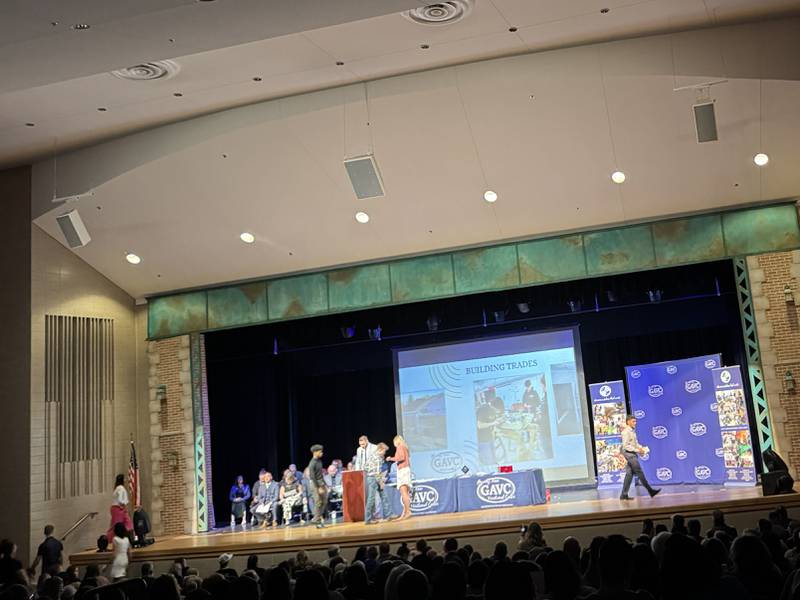 Grundy Area Vocational students head to the stage to receive their Perfect Attendance Awards during an awards ceremony on Wednesday, April 30, 2025.