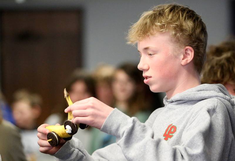Eli Hammers of Oglesby Washington School, gets ready to place his edible car on the ramp to race it during the 29th annual Edible Car Contest on Wednesday, Feb. 26, 2025 in the cafeteria at Illinois Valley Community College.