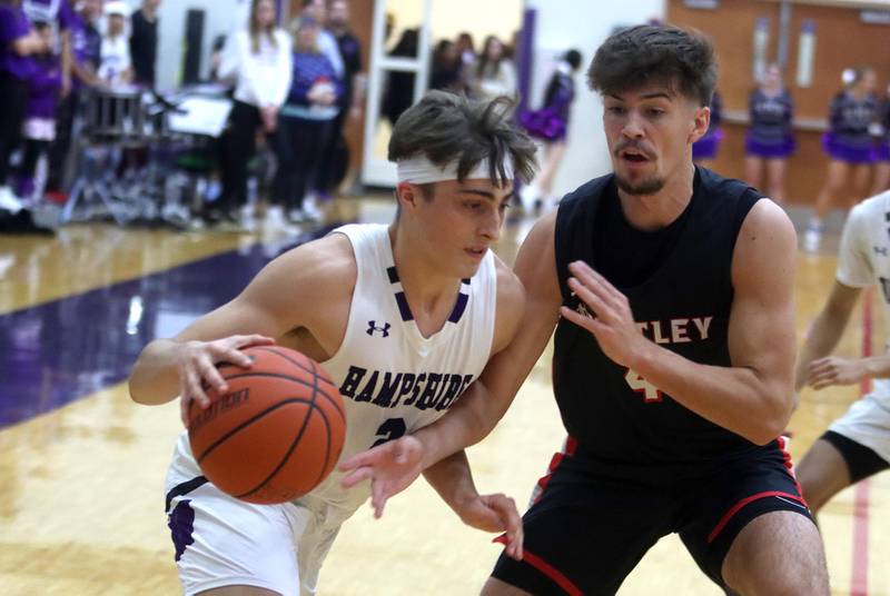 Huntley’s Ian Ravagnie, right, guards Hampshire’s Joseph Costabile in boys basketball at Hampshire on Friday.