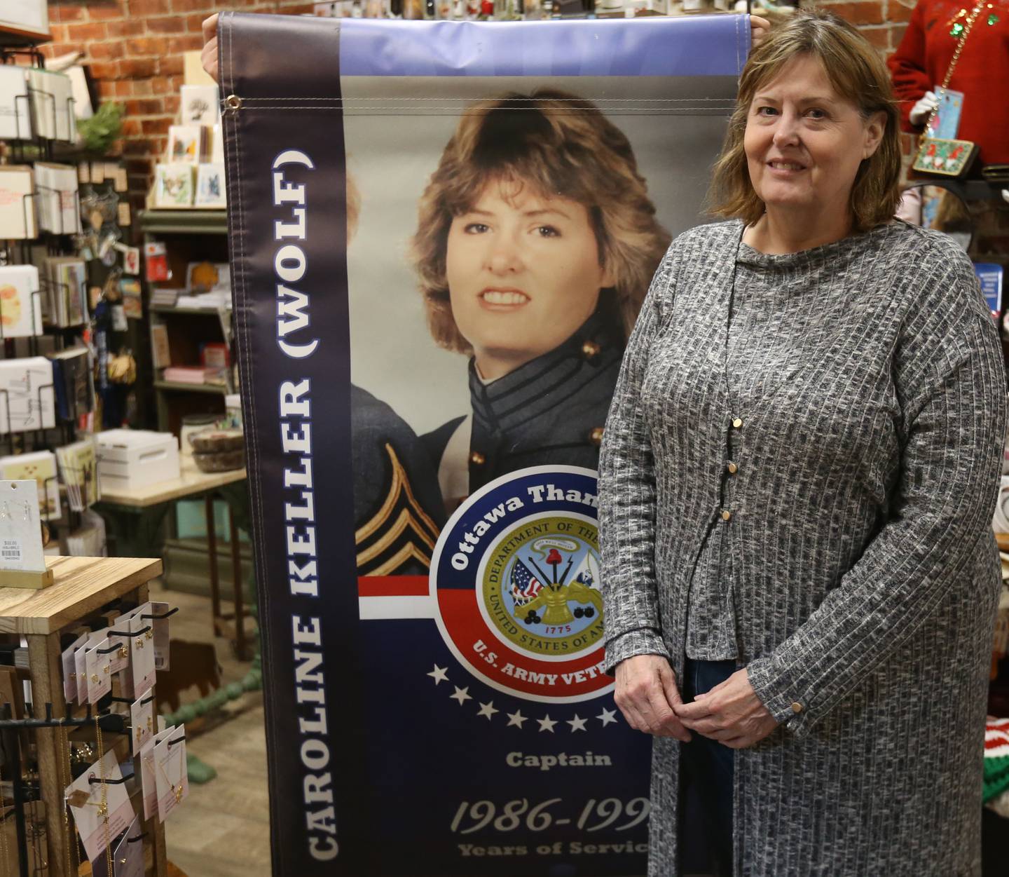 Caroline Wolf, owner of Heartland by Hand, poses for a photo in her store on Tuesday, Oct. 31, 2023 in Ottawa. Wolf is a veteran of Desert Storm.