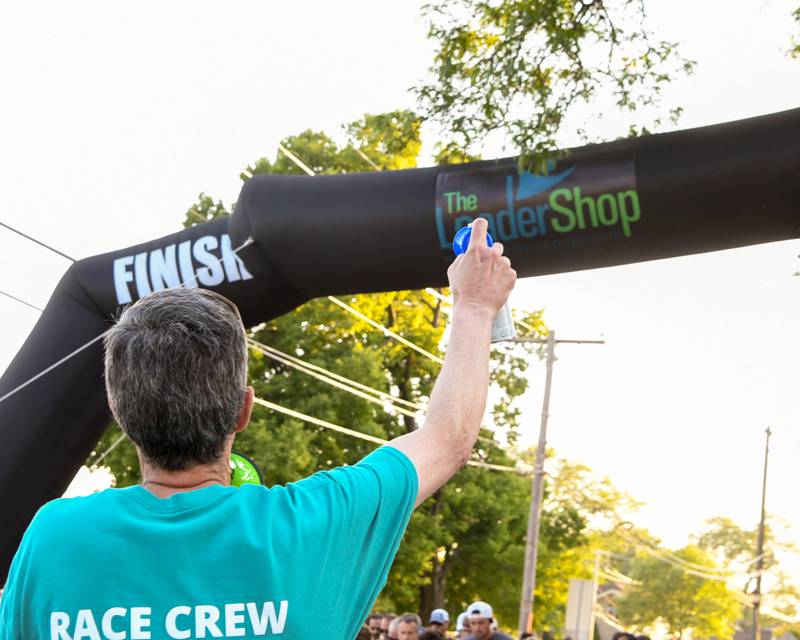 Board member, Treasure and chairman of the Leadershop 5k event Jim Hinckley of La Grange sounds the airhorn signifying the start of the 5k on Friday June 9, 2023.