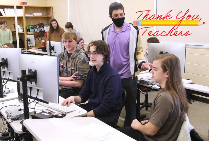 Educator Gregory D'Addario, who teaches english and Spartan TV at Sycamore High School, goes over some ideas for a movie scene recreation with students in his class Wednesday, March 1, 2023, at the school.