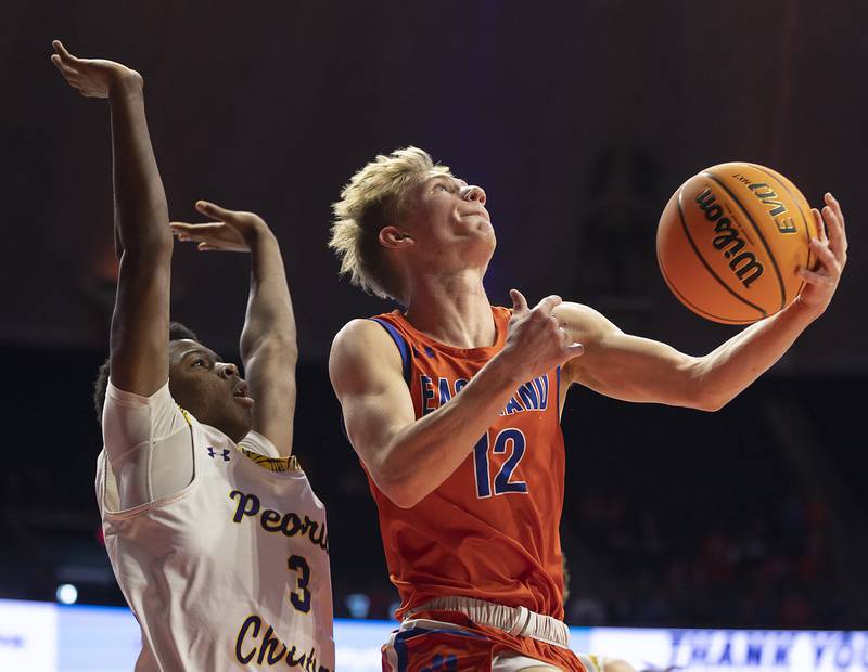 Eastland’s Adam Awender puts up a shot against Peoria Christian’s Jacob Walton Thursday, March 13, 2025, during the Class 1A boys basketball state semifinal.