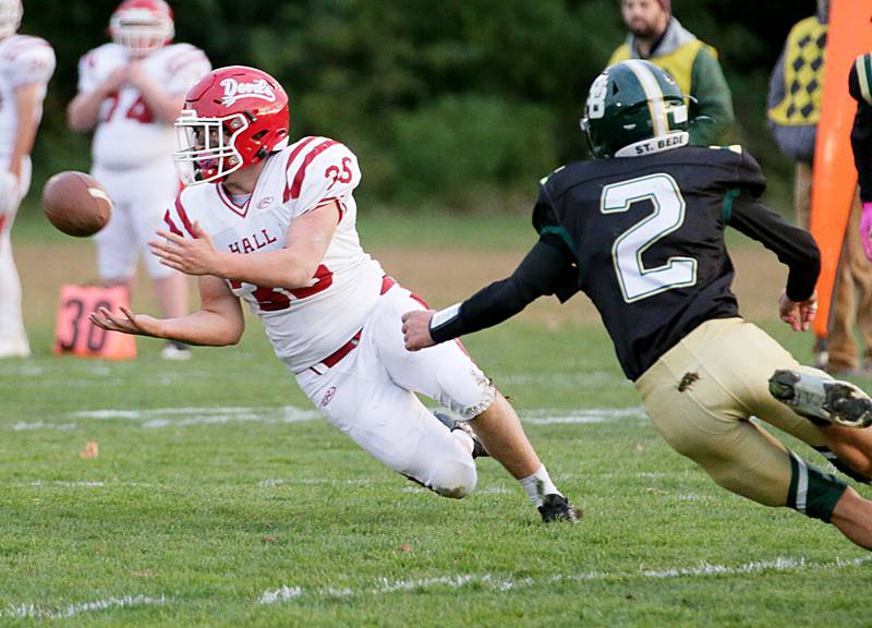 Hall's Alex Maldanado (35) completes a pass as St. Bede's Ryan Brady (2) defends on Saturday, Oct. 15, 2022 at the Academy in Peru.