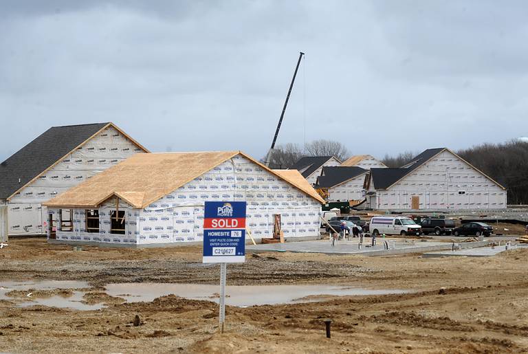 Homes are being built Thursday, April 7, 2022, in the new Trails of Woods Creek, a planned 279-unit subdivision in the Huntley School District.