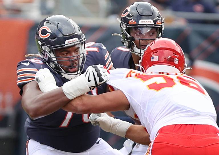 Chicago Bears offensive lineman Braxton Jones blocks for quarterback Justin Fields Sunday, Aug. 13, 2022, during their game against the Chiefs at Soldier Field in Chicago.