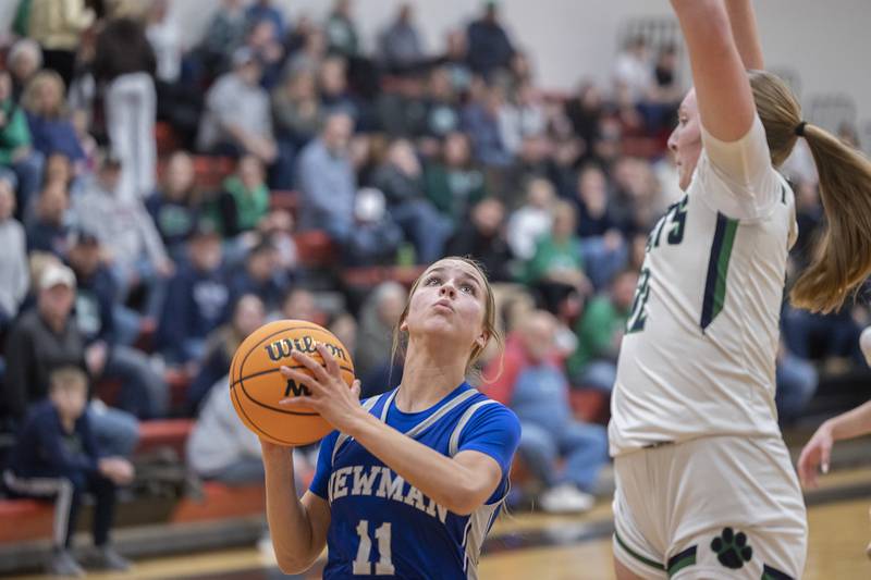 Newman’s Brooklyn Smith looks towards the hoops against River Ridge Thursday, Feb. 20, 2025, during the Class 1A girls basketball regional at Forreston.
