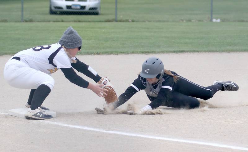 Putnam County's Reise Zeller tags out Flanagan-Cornell/Woodland's Kortney Harms while sliding into third base on Tuesday, May 2, 2023 at Woodland High School.