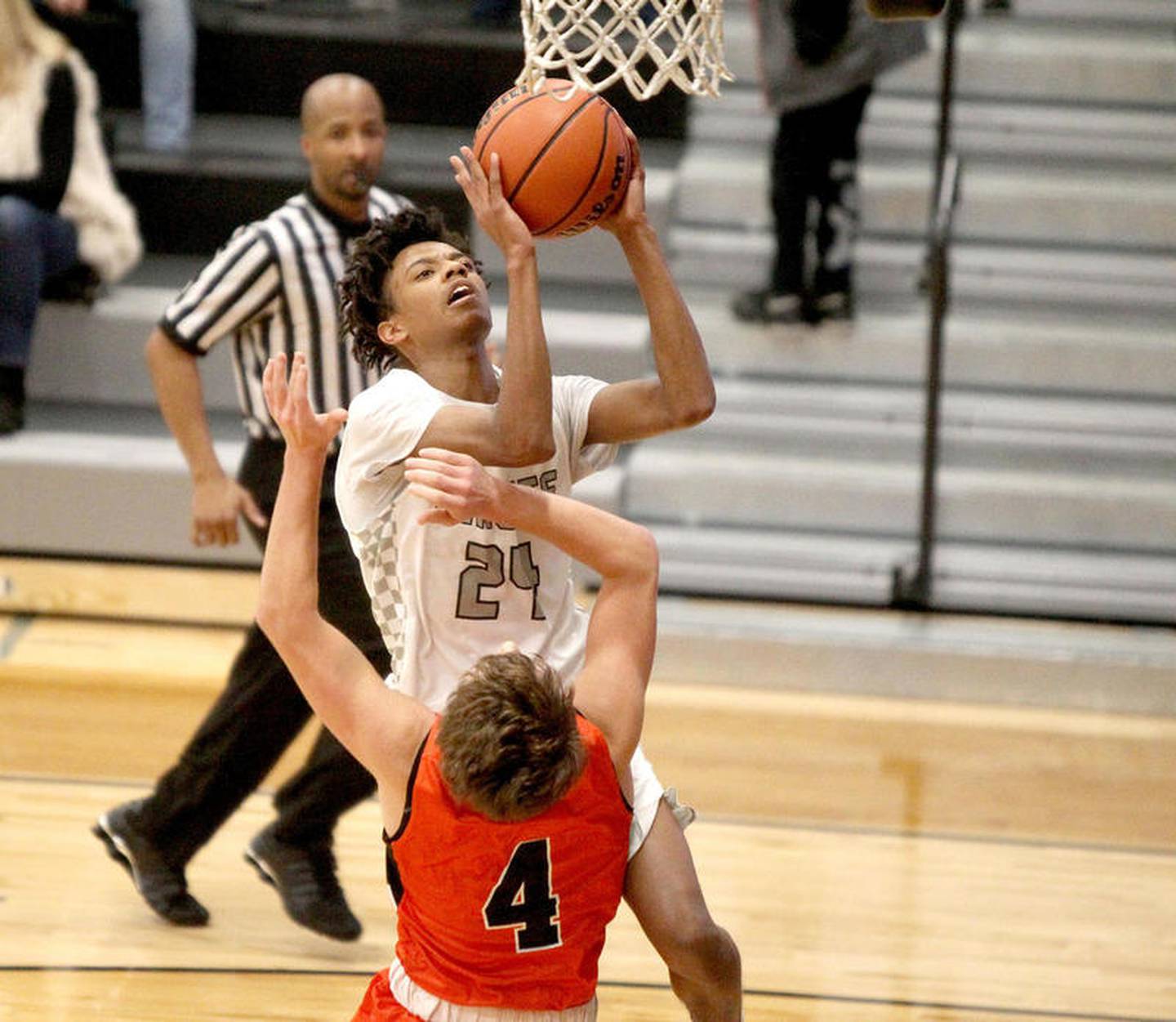 Kaneland's Jamari Meeks (24) shoots the ball during a game against Sandwich at Kaneland on Dec. 13.