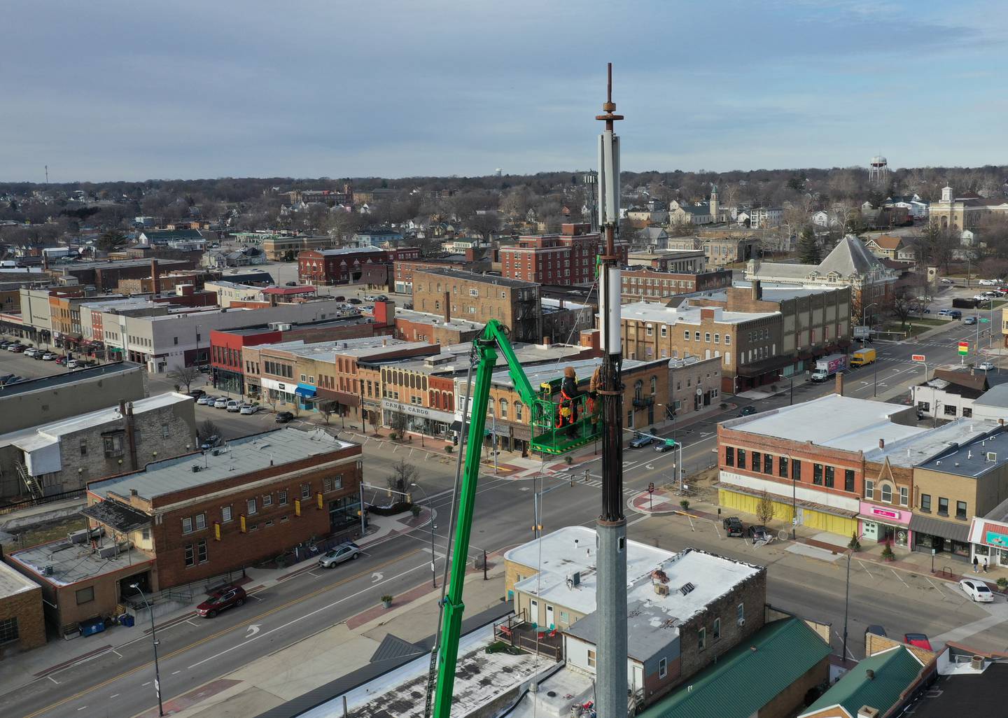 Workers from ADB Companies install 5G on top of a cellular tower at the corner of Canal and Joliet Streets on Monday, Dec. 19, 2022 downtown La Salle.