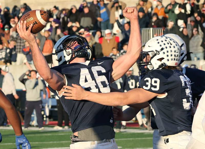 Cary-Grove's Logan Abrams celebrates his late game go-ahead touchdown with teammate Holden Boone Saturday, Nov. 25, 2023, during their IHSA Class 6A state championship game against East St. Louis in Hancock Stadium at Illinois State University in Normal.