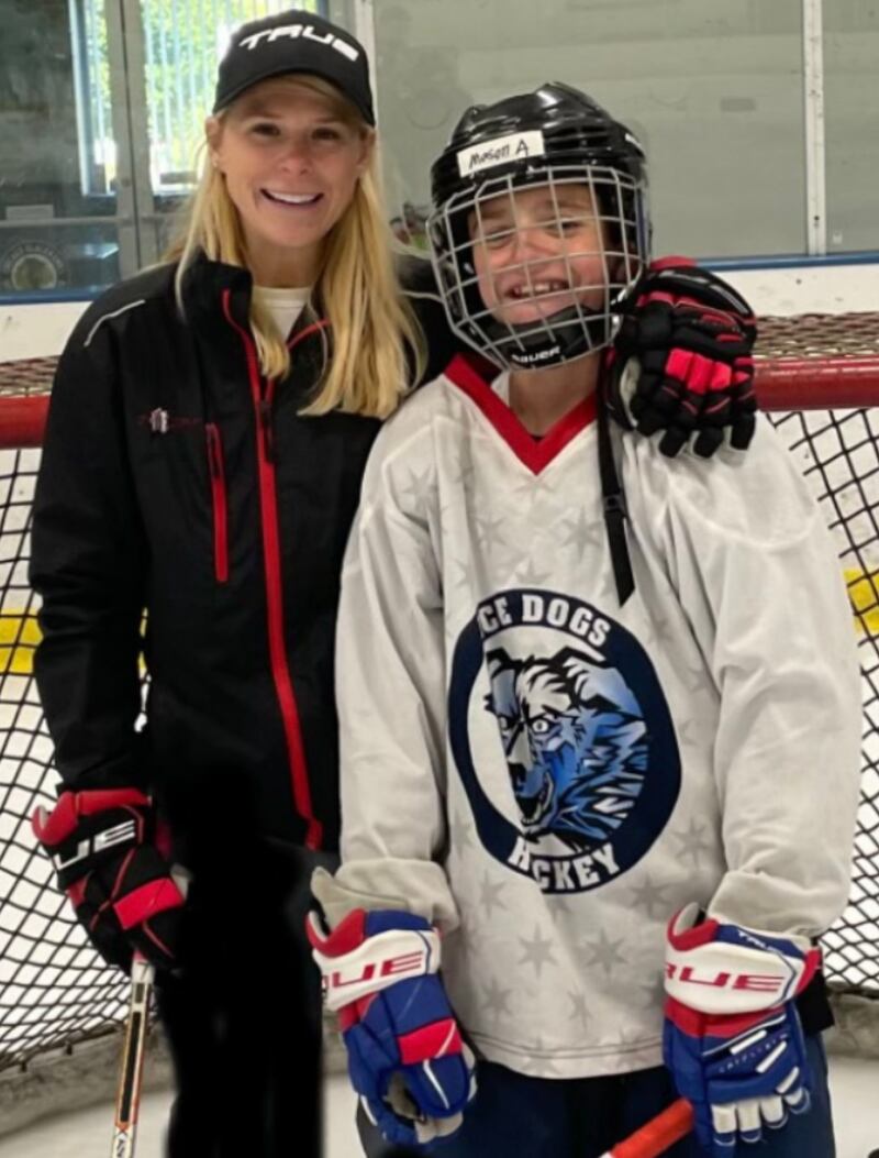 Glacier Ice Arena coach Charice Paoli and student Mason Asis. The National Hockey League Coaches Association recently selected Paoli for a prestigious Female Coach spotlight.