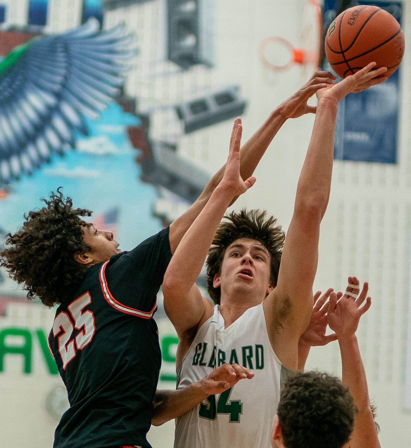 Wheaton Warrenville South's Braylen Meredith (25) defends the paint against Glenbard West's Braden Huff (34) during their Bartlett class 4A Sectional final game at Bartlett High School on Friday, March 4, 2022.