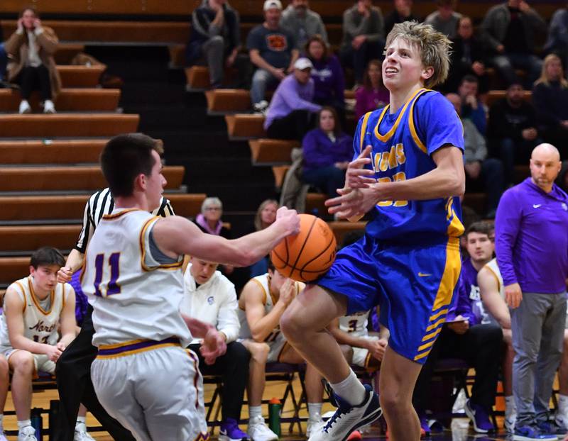 Downers Grove North’s Connor Crowley (11) strips the ball from Lyons Township’s Miki Vasilakopoulos as Vasilakopoulos goes for a layup during a game on January 15, 2026 at Downers Grove North High School in Downers Grove .