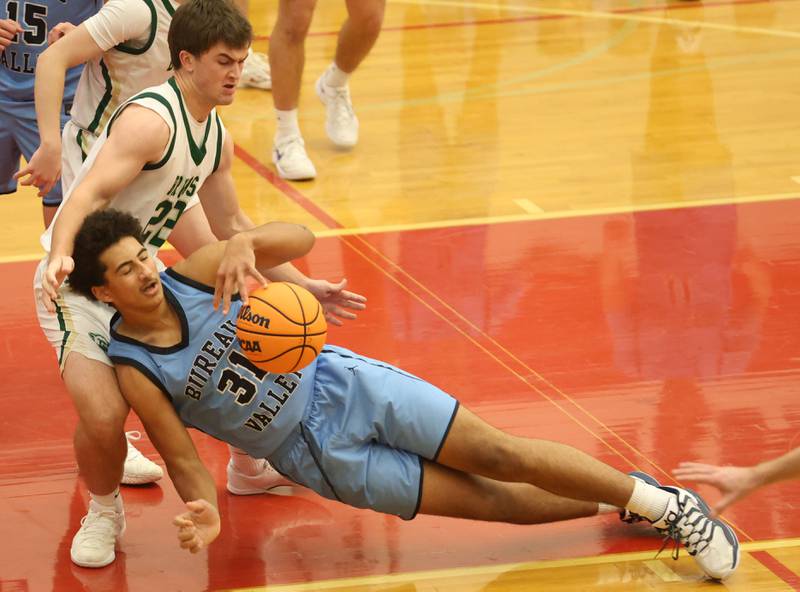 Bureau Valley's Dakarai Martin draws an offensive foul on St. Bede's AJ Hermes during the Colmone Classic on Thursday, Dec. 11, 2025 at Hall High School.