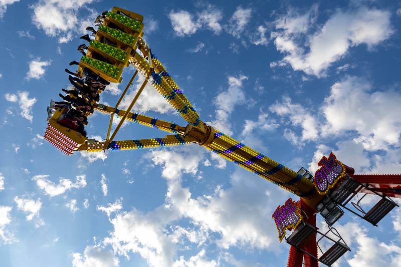 Taste of Joliet attendees ride the Freak Out at Busey Bank Field at Joliet Memorial Stadium on June 20, 2025.