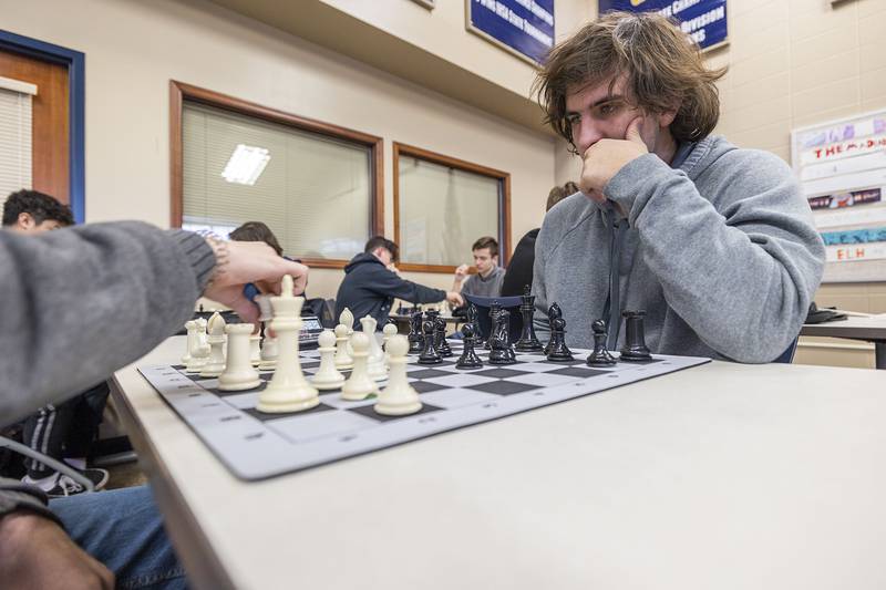 Sterling High School senior chess player Ethan Howell contemplates his next move during practice Wednesday, Jan. 25, 2023 ahead of Saturday's sectional meet in Rockford.