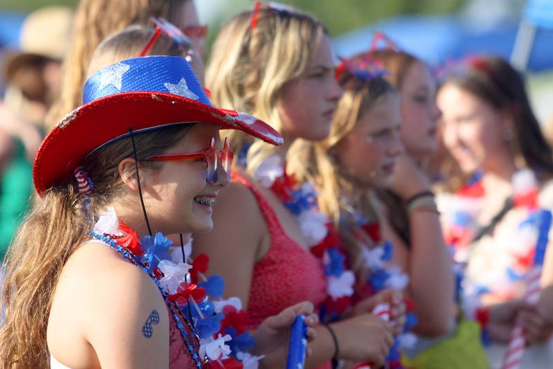 Alaina Vetta, 12, left, of Cary watches a dance performance with friends during the Stars N’ Stripes Fest at Cary-Grove Park in Cary on Saturday, June 28, 2025.