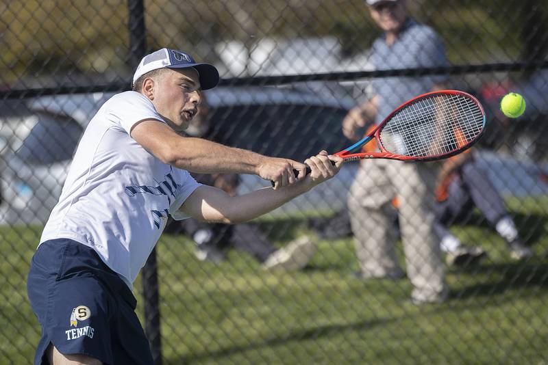 Sterling doubles player Elias Jensen plays a shot against Dixon during a tennis match Thursday, May 4, 2023.