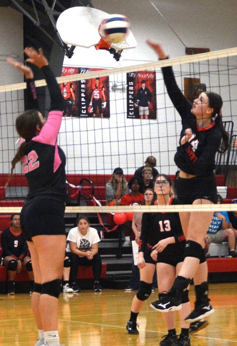 LaMoille senior Claire Lovgren takes a hit in Thursday's Senior Night match against Galva.