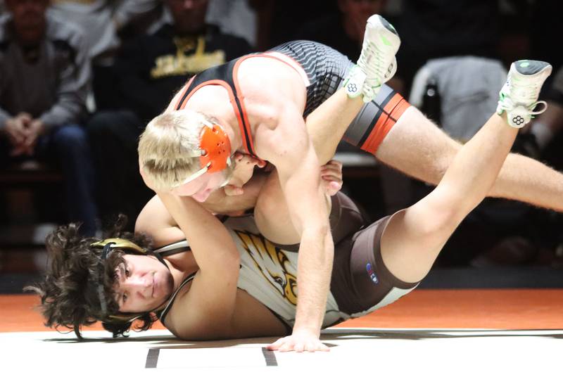 Crystal Lake Central’s Ethan Stroh, top, battles Jacobs’ Jesus Reyes at 175 pounds in varsity boys wrestling on Tuesday, Jan. 20, 2026 at Crystal Lake Central High School in Crystal Lake.