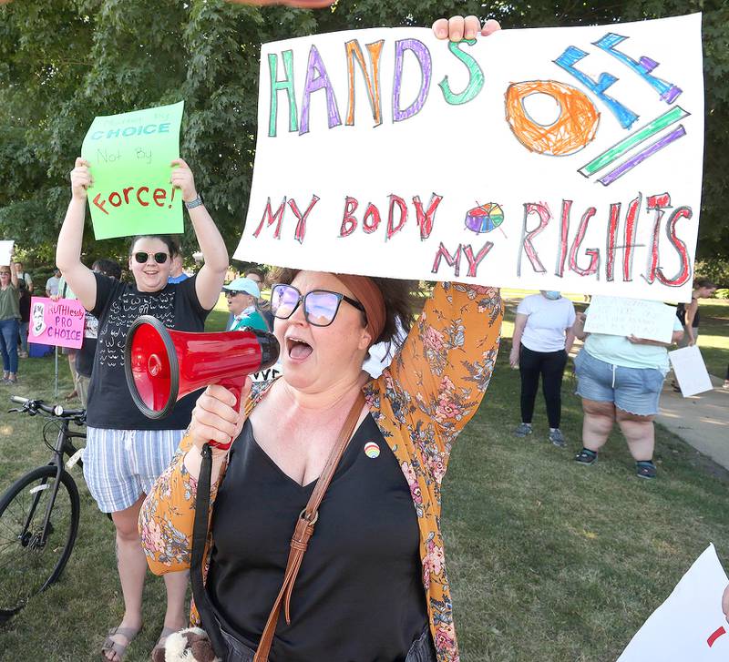 Kendra Holton, from DeKalb, leads a chant Friday, June 24, 2022, during a rally for abortion rights in front of the DeKalb County Courthouse in Sycamore. The group was protesting Friday's decision by the Supreme Court to overturn Roe v. Wade, ending constitutional protections for abortion.