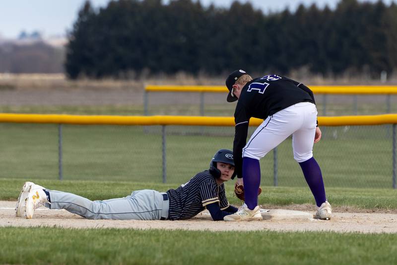 Nate Kelly of Serena attempts to throw out Thomas Giebel of Hiawatha as he slides back to first base looking at pitcher on Monday, April 7, 2025 at Serena High School in Serena.