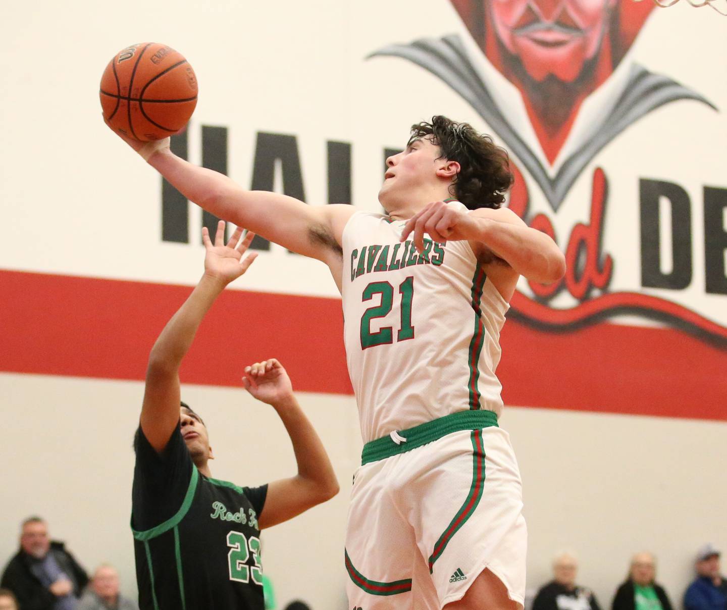L-P's Josh Senica (right) grabs a rebound over Rock Fall's Andrew Hernandez (left) during the Colmone Classic tournament on Friday, Dec. 9, 2022 at Hall High School in Spring Valley.