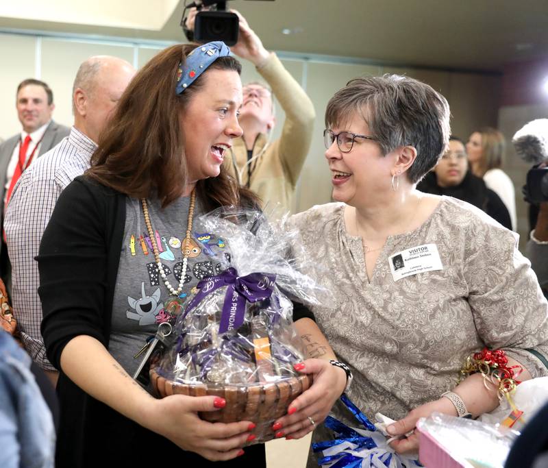 Bolingbrook High School teacher Erin Clifford shares a moment with her mom, Kathleen Steben, as it was announced she had won a Golden Apple Award for Excellence in Teaching.