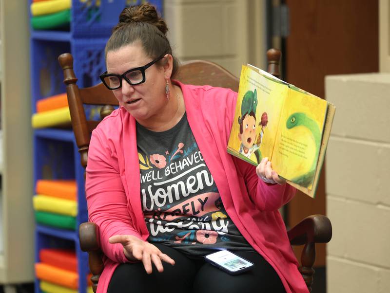 Cortland Elementary School librarian/media assistant Leslie Leahy reads a book to fourth graders on March 31, 2026, in the school library.