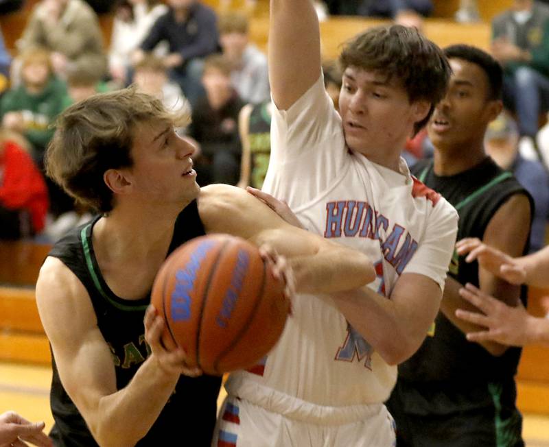Crystal Lake South's Zachary Peltz drives to the basket against Marian Central's Braedon Todd during the Johnsburg Boys Basketball Thanksgiving Tournament Monday, Nov. 21, 2022, between Crystal Lake South and Marian Central at Johnsburg High School.