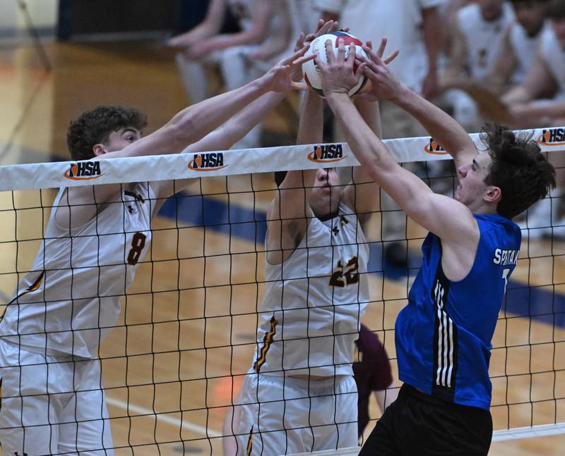 Ben Brown of York leaps for a kill in front of David Neylon, left, and Noah Konopack of Lincoln-Way West during the boys state volleyball quarterfinals at Hoffman Estates High School on Friday, May 31, 2024 in Hoffman Estates.