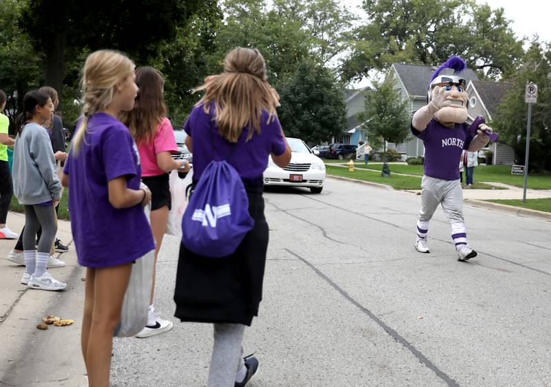 The Downers Grove North trojan mascot walks in the school’s homecoming parade on Friday, Sept. 23, 2022.